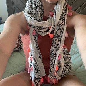 Black and white design with pink and orange tassels